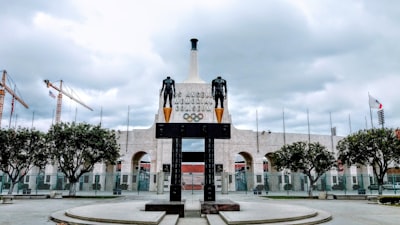 black and brown cross statue rams teams background