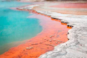 A freshly painted thermal pool surface with clean, bright white and blue colors.