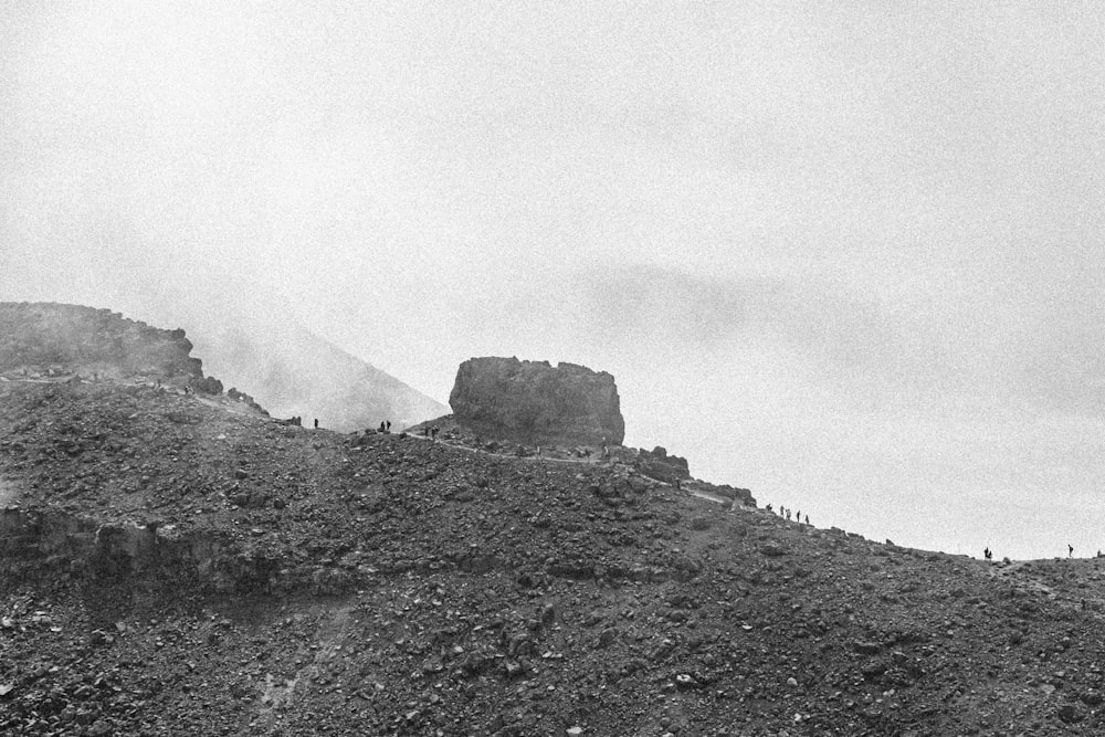 grayscale photo of rock formation