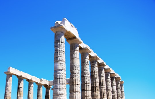 brown concrete building under blue sky during daytime in Temple of Poseidon Greece