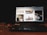 A laptop displaying a website with various images including a woman sitting indoors, a moving race car, a cabin in a mountainous area, and a dog. The device is placed on a wooden table with a glass of water and a notebook nearby, in a dimly lit environment.