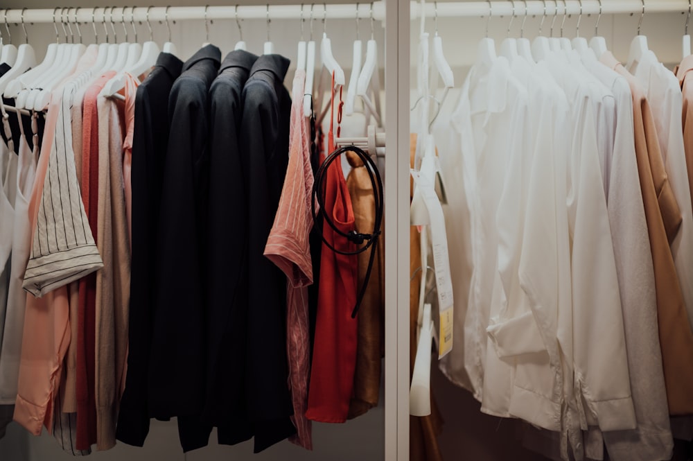 black and red clothes hanged on white wooden door