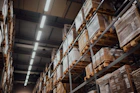 brown cardboard boxes on white metal rack