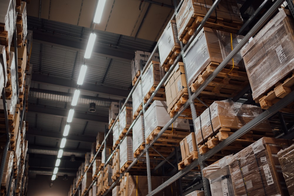 brown cardboard boxes on white metal rack in a b2c fulfilment warehouse