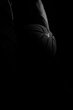 Close-up image of a dynamic sports action shot with deep shadows and cinematic lighting, highlighting intense emotion.