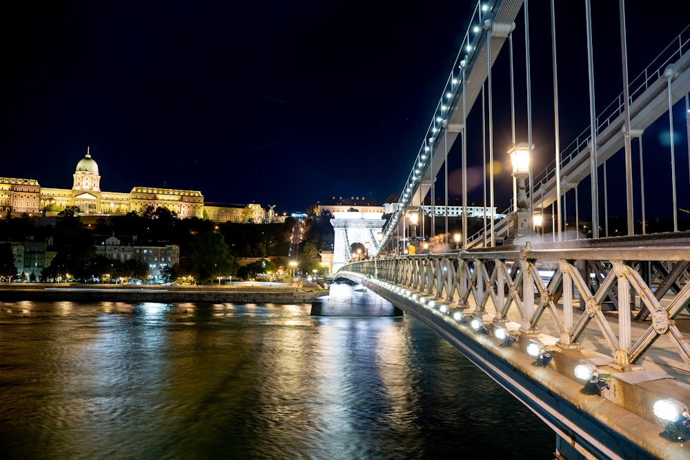 white bridge over river during night time