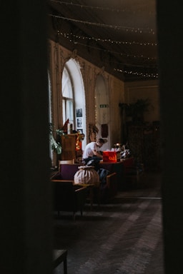 A cozy, mysterious hidden room with soft lighting and vintage decor.