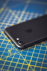 A student using a smartphone to measure acceleration in a physics experiment.