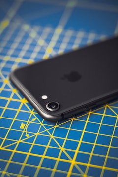 A student using a smartphone to measure acceleration in a physics experiment.