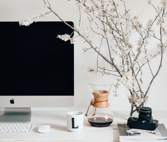 silver imac on white table