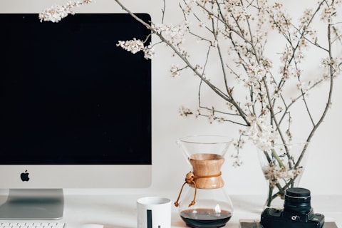 silver imac on white table