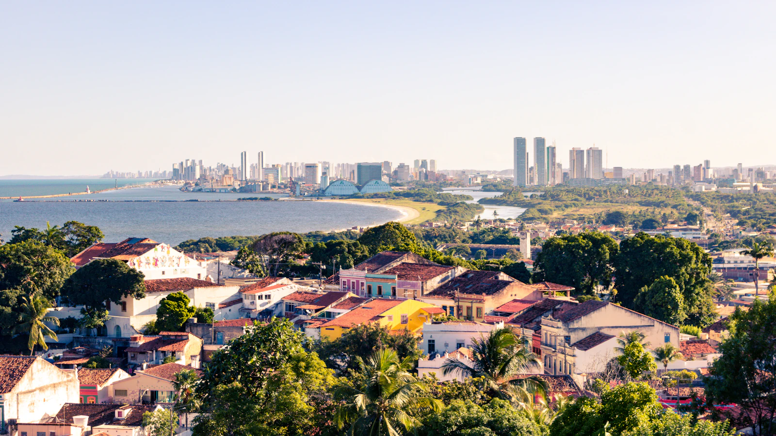 Olinda’s rooftops, with Recife’s towers along the coast beyond — Recife and Olinda, Brazil