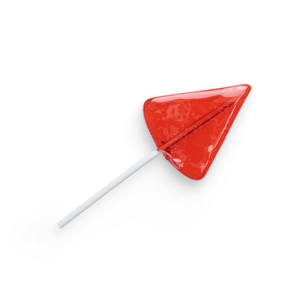 red lollipop on white background