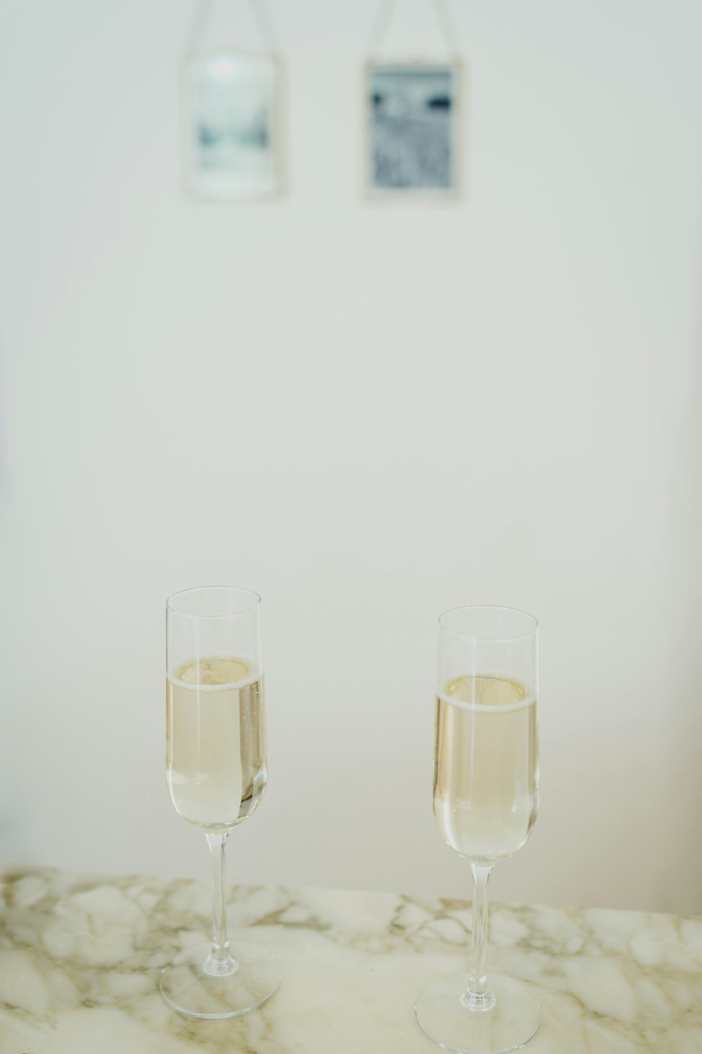 2 clear drinking glasses on white table