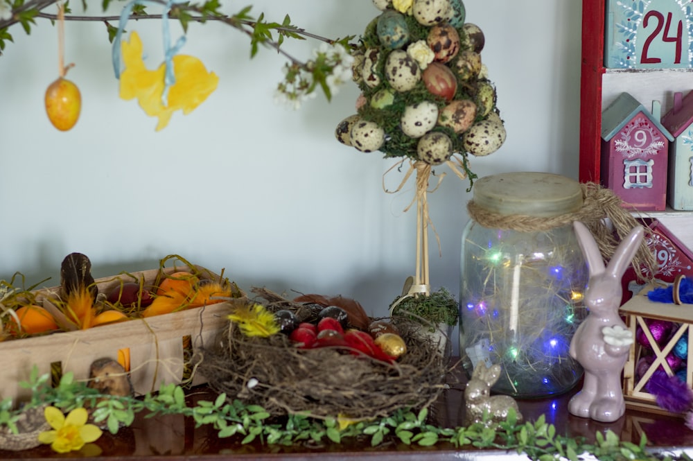 a shelf with a basket of fruit and a bird nest