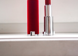 red lipstick on white table