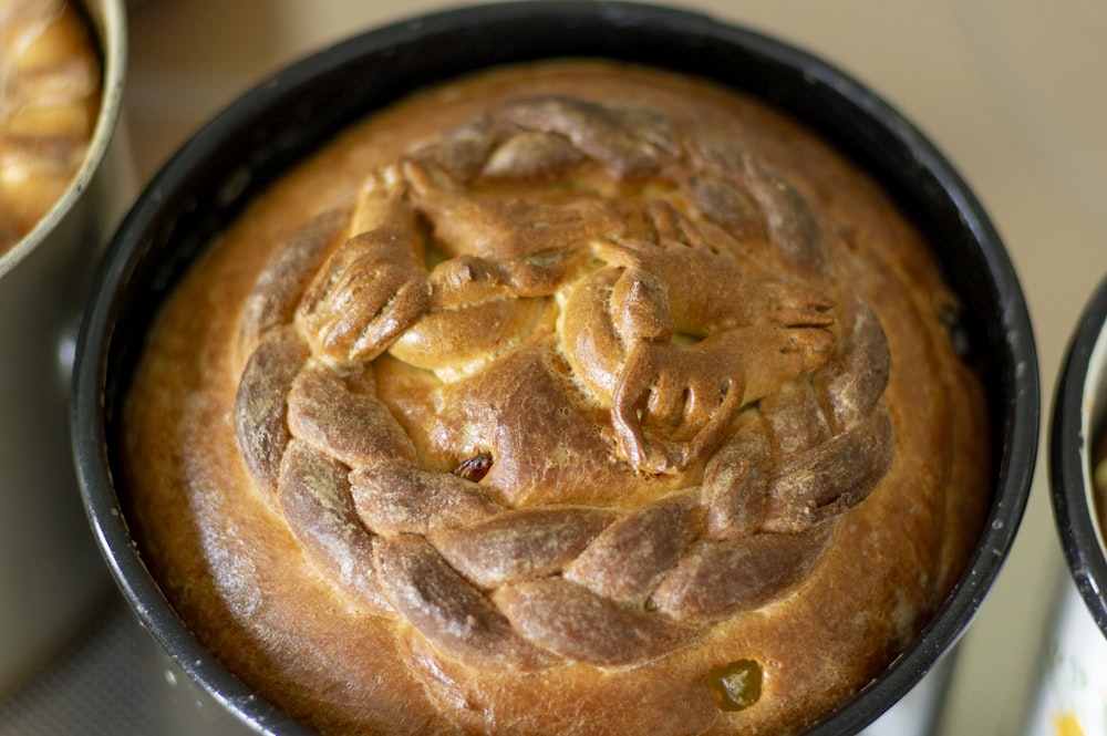 brown pie on black ceramic bowl