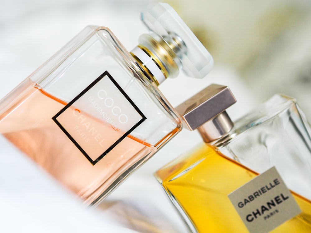 Clear glass perfume bottle with yellow liquid photo – Free Bottle Image on  Unsplash