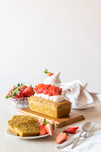 brown and white cake with strawberry on top