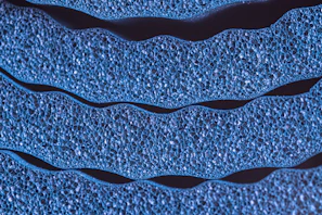 Close-up of depth filtration membrane structure highlighting pore complexity in elegant indigo hues.