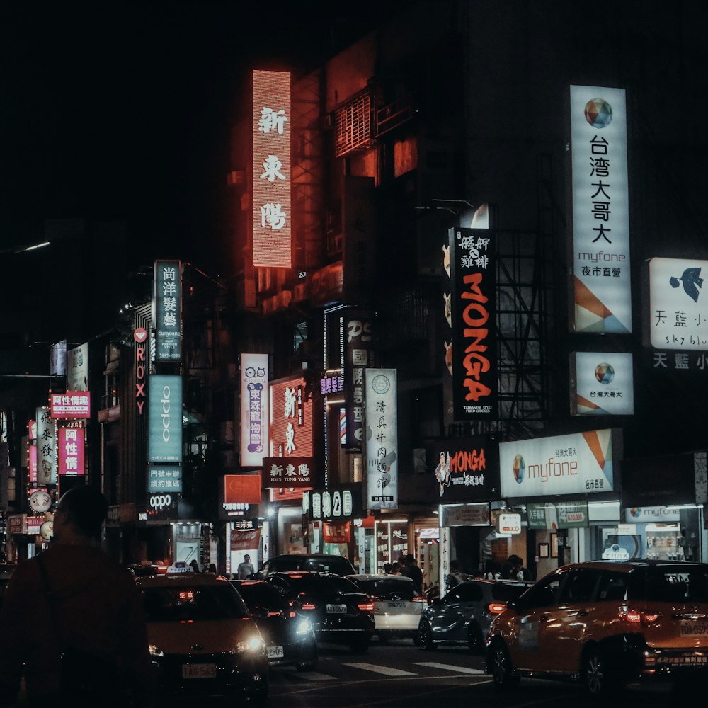 people walking on street during night time