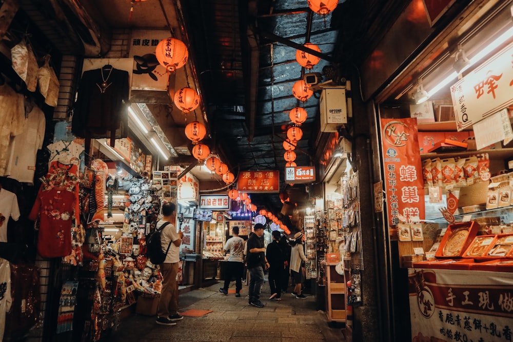 people walking on street during nighttime