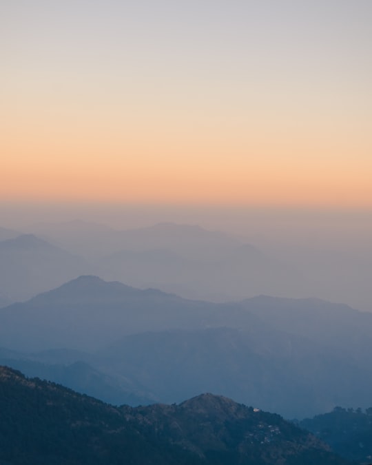 mountains under white clouds during daytime in Uttarakhand India