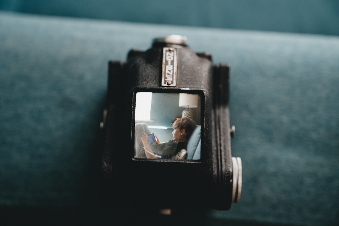 black camera lens on blue textile