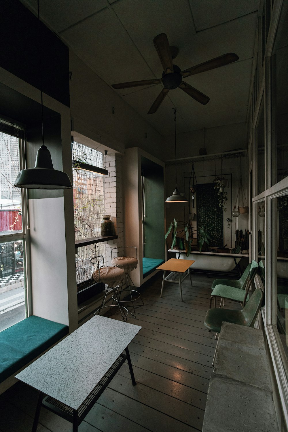 black metal framed orange padded chairs and table