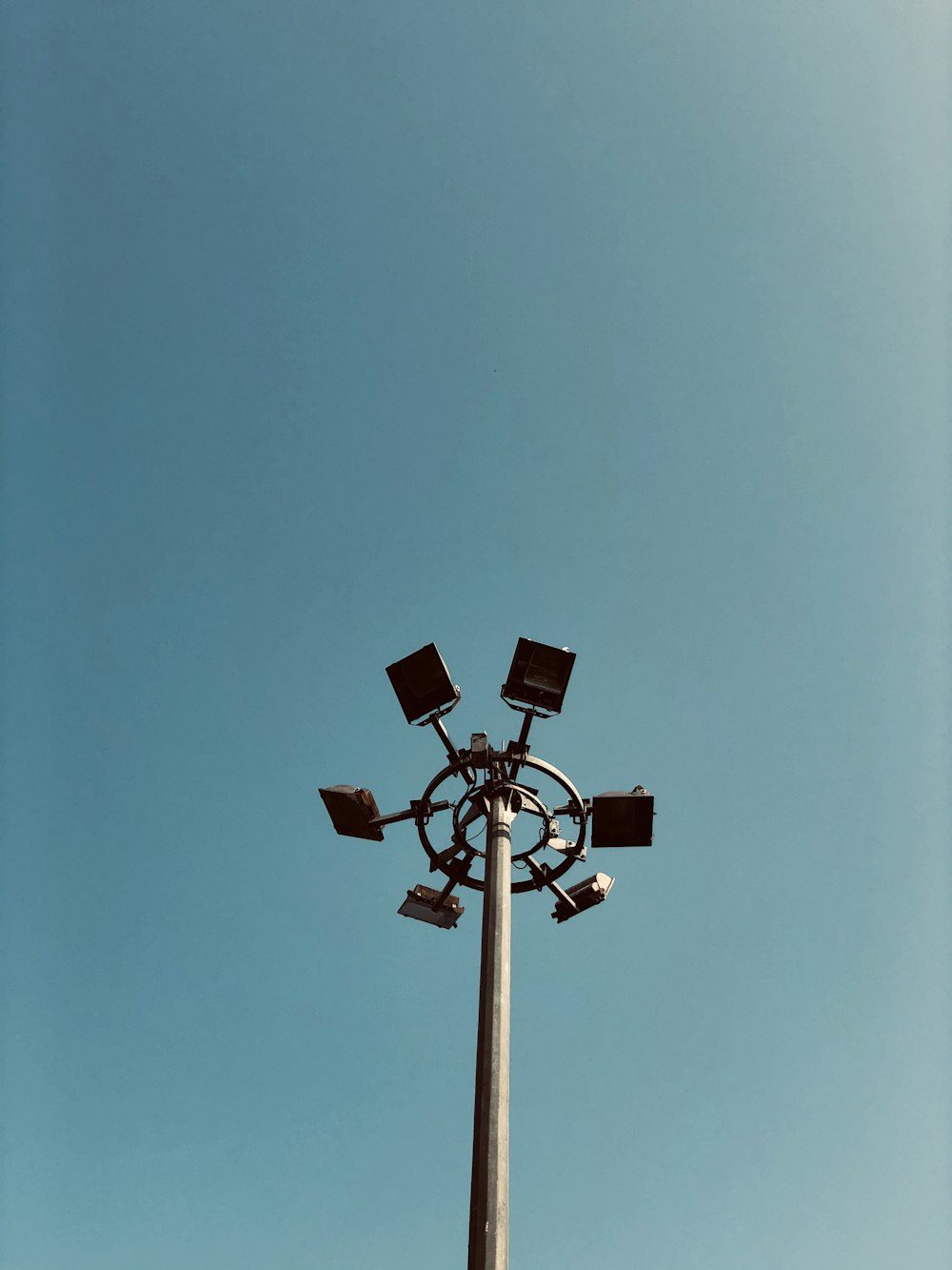 brown wooden street light under pink sky