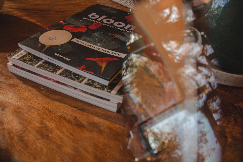 white and black book on brown wooden table