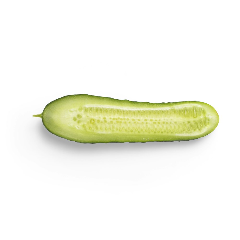 green cucumber on white background