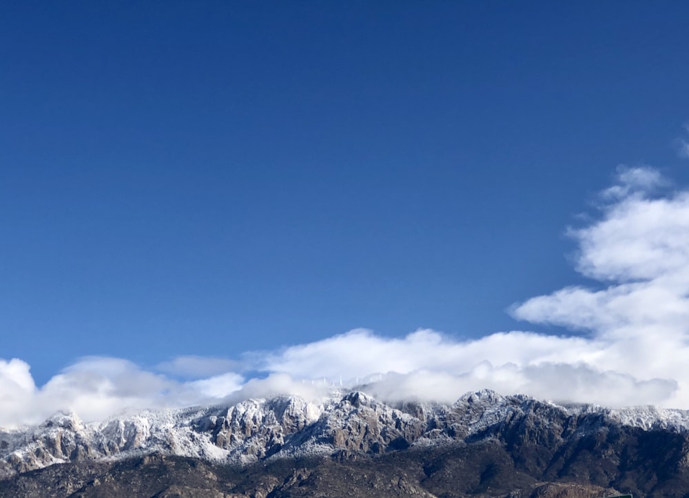 snow covered mountain under blue sky during daytime