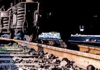 Close-up of a railcar undercarriage being inspected using advanced NDT equipment.