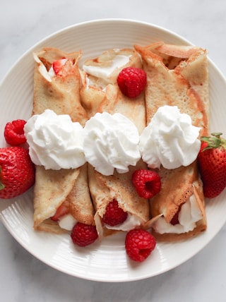 strawberry and banana on white ceramic plate