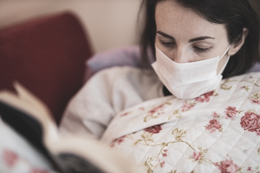 woman with the flu wearing a mask