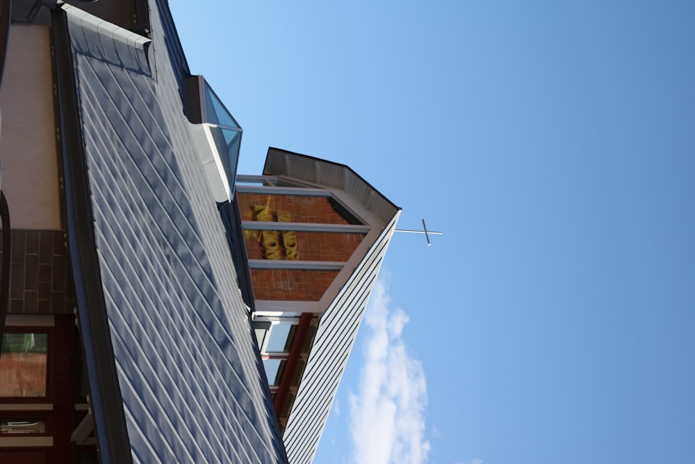 brown and white wooden house under blue sky during daytime