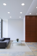 A sleek modern living room with minimalist black and white decor showcasing luxury interior design.