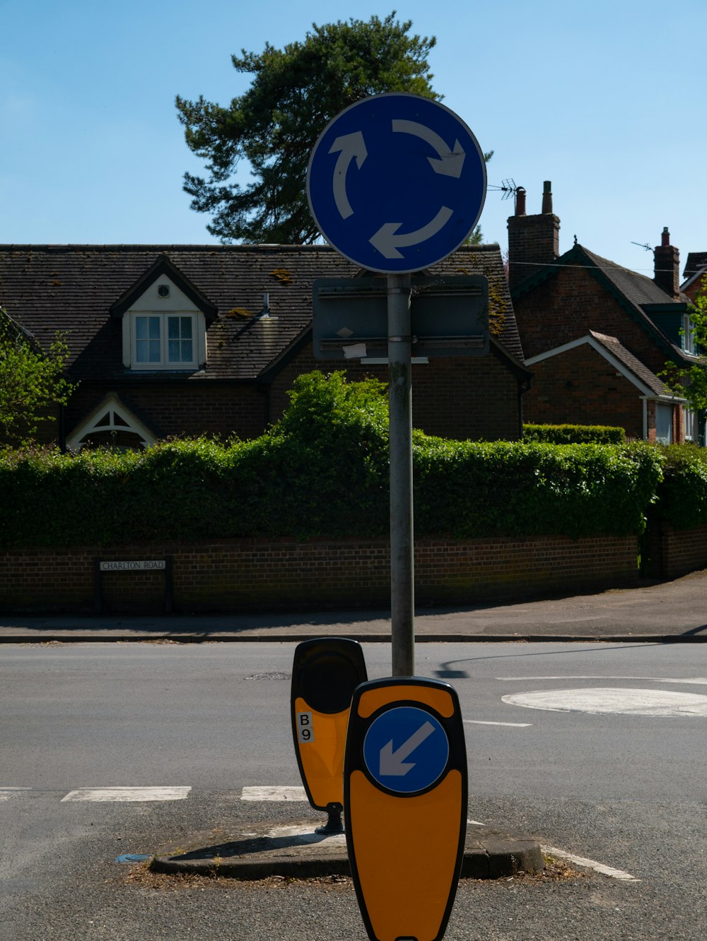 blue and yellow road sign