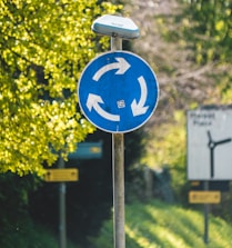 blue and white road sign