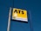 A signboard mounted on a metal post and wooden pole against a clear blue sky. The sign features the large letters 'ATS' on a yellow background with a stylized road graphic. Below, it reads 'EUROMASTER' in blue text next to a circular logo with a yellow and green color scheme.