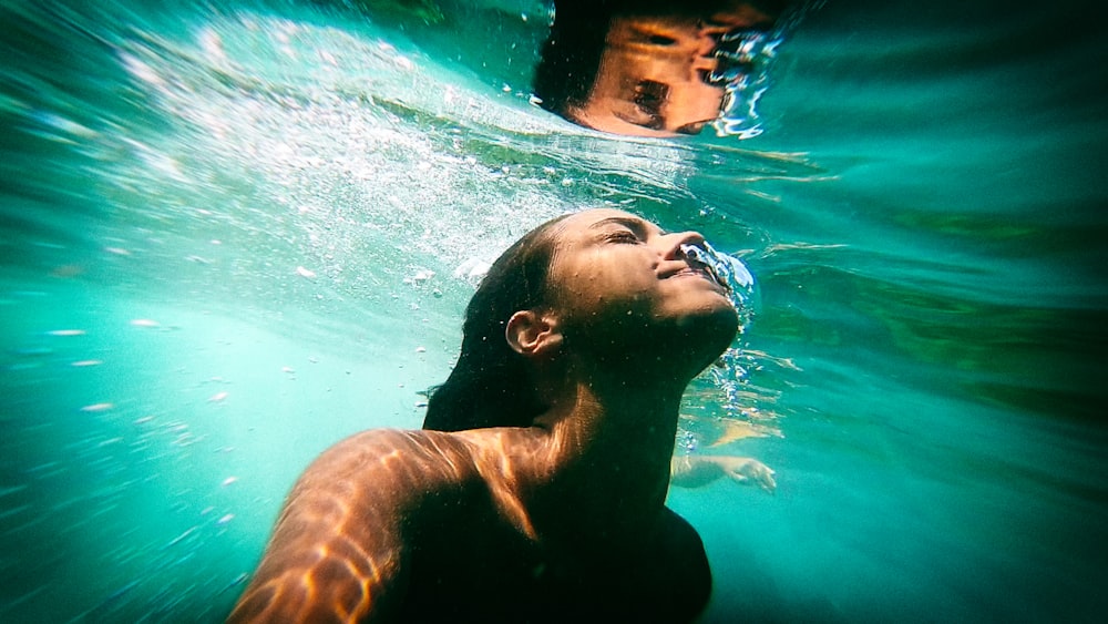 man in water with water splash