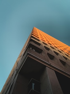 brown concrete building under blue sky during daytime
