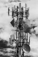 grayscale photo of electric tower