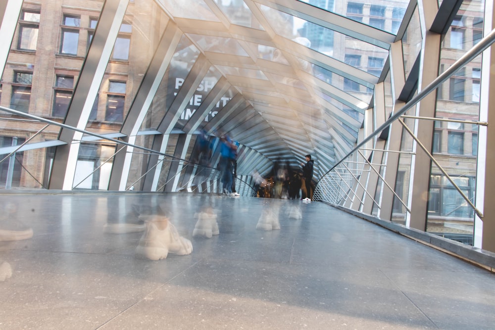 people walking on gray concrete floor