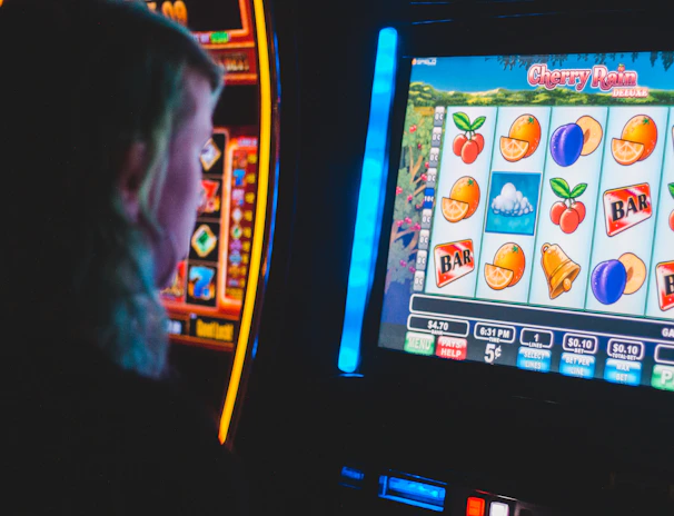 Close-up of spinning reels on a virtual slot game with vibrant fruit icons