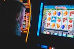 man playing slot machine game