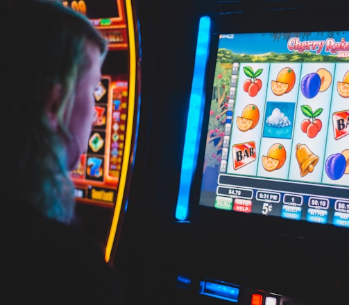 man playing slot machine game