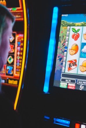 man playing slot machine game