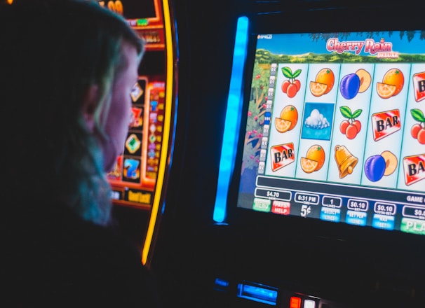 man playing slot machine game